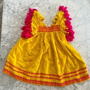 Mer St Barth marigold with hot pink poms poms and embroidery. Size 2T.